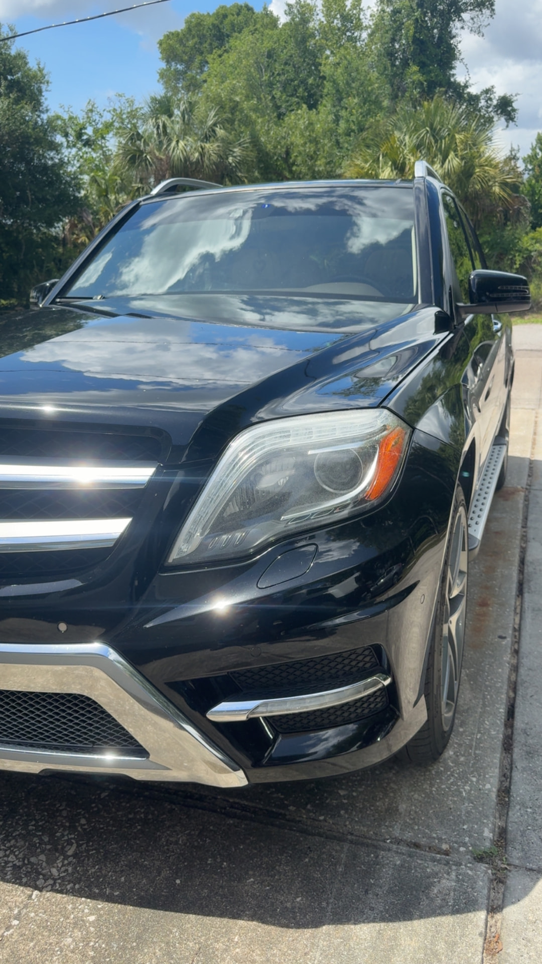 Mercedes-Benz GLK headlight with surface haze and spotting before restoration in Citrus County FL
