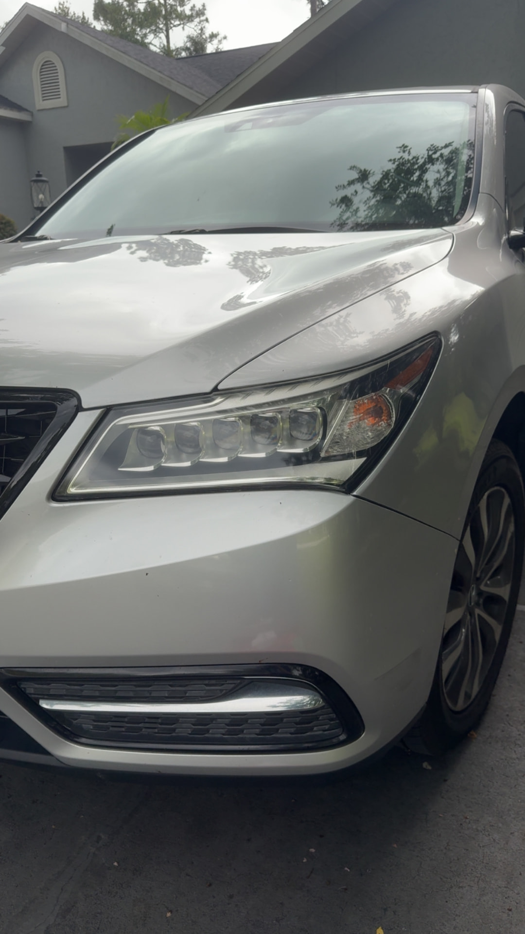 Acura MDX headlight restored to a clear finish after Crystal Clear headlight restoration in Citrus County FL