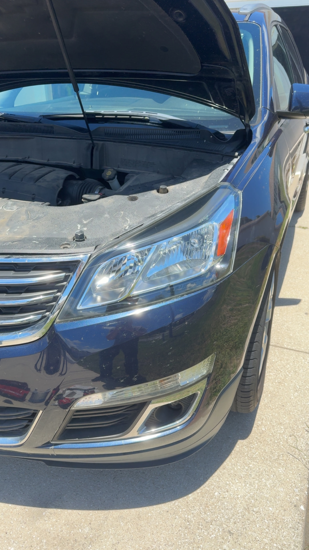 Chevrolet Traverse headlight restored to a clear finish after Crystal Clear restoration in Citrus County FL
