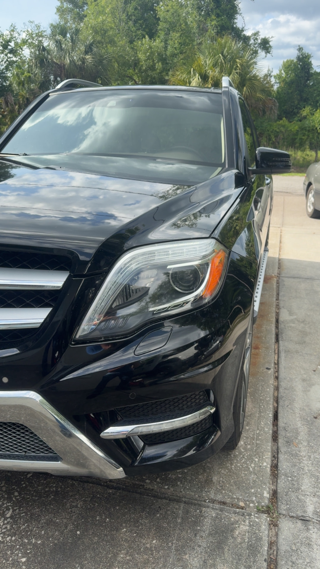 Mercedes-Benz GLK headlight restored to a clear glass-like finish by Crystal Clear in Citrus County FL