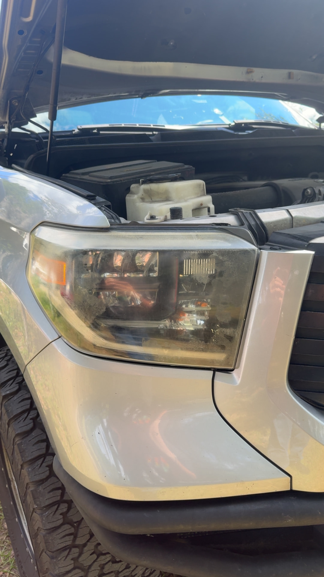 Toyota Tundra headlight with cloudy haze and yellowing before restoration in Citrus County FL